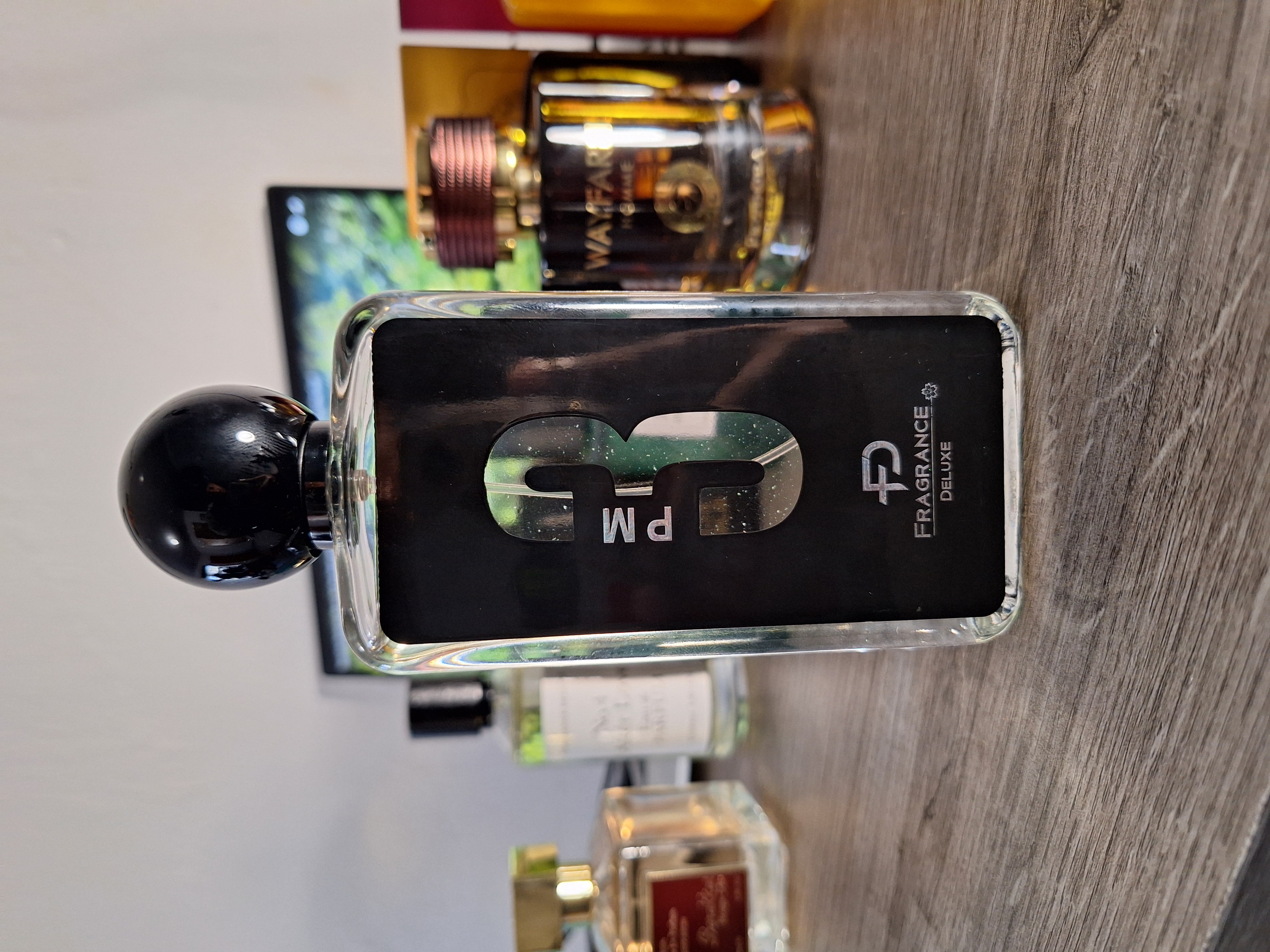 3PM perfume bottle with masculine design and deep blue glass